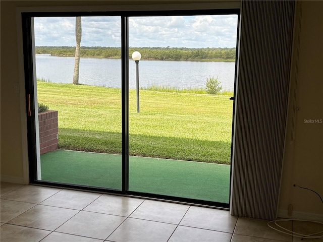 32 S Ocean Palm Villa Dr S Unit 320, Flagler Beach, FL 32136 - doorway with a water view and light tile patterned flooring