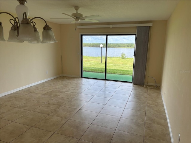 32 S Ocean Palm Villa Dr S Unit 320, Flagler Beach, FL 32136 - unfurnished room with light tile patterned flooring, a water view, and a ceiling fan