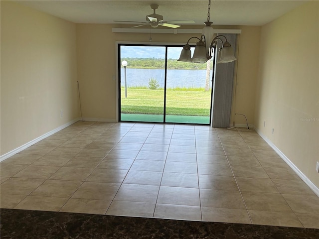 32 S Ocean Palm Villa Dr S Unit 320, Flagler Beach, FL 32136 - empty room with tile patterned floors, a water view, and ceiling fan
