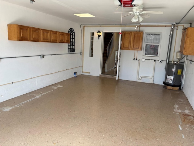 32 S Ocean Palm Villa Dr S Unit 320, Flagler Beach, FL 32136 - garage featuring electric water heater, a ceiling fan, and a garage door opener