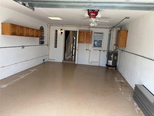 32 S Ocean Palm Villa Dr S Unit 320, Flagler Beach, FL 32136 - garage featuring a garage door opener, electric water heater, and ceiling fan