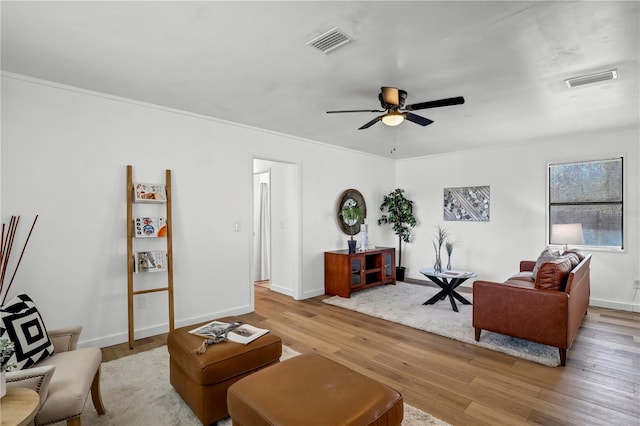 54221 Cravey Rd, Callahan, FL 32011 - living area with wood finished floors, a ceiling fan, and ornamental molding