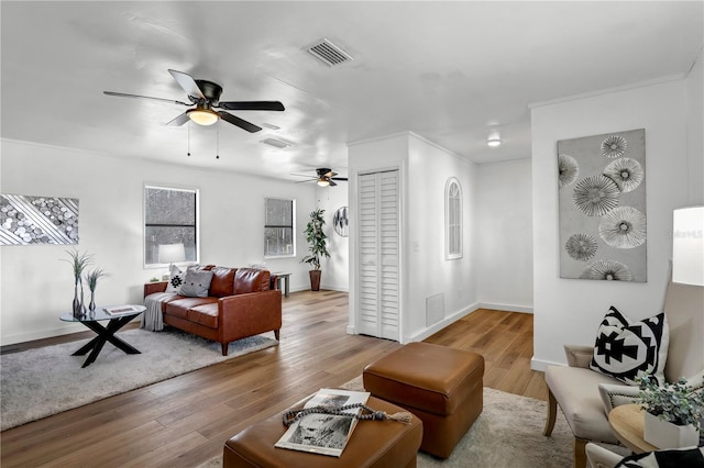 54221 Cravey Rd, Callahan, FL 32011 - living area featuring ceiling fan, wood finished floors, and crown molding