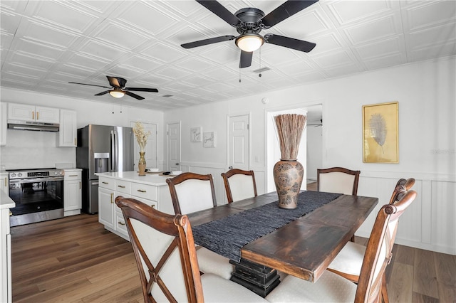 54221 Cravey Rd, Callahan, FL 32011 - dining area featuring ceiling fan, an ornate ceiling, wood finished floors, and wainscoting