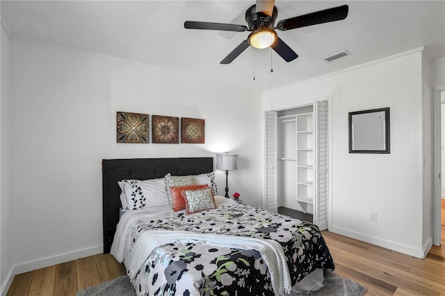 54221 Cravey Rd, Callahan, FL 32011 - bedroom with light wood-type flooring, a closet, a ceiling fan, and crown molding