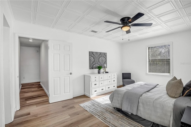 54221 Cravey Rd, Callahan, FL 32011 - bedroom featuring light wood-style flooring, an ornate ceiling, and a ceiling fan