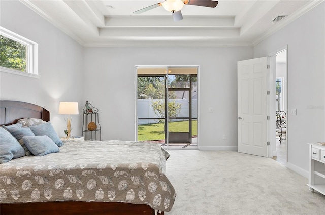 15 Long Pl, Palm Coast, FL 32137 - bedroom featuring access to outside, a tray ceiling, multiple windows, carpet floors, and crown molding