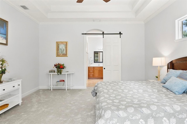 15 Long Pl, Palm Coast, FL 32137 - bedroom with a raised ceiling, a barn door, carpet flooring, connected bathroom, and ornamental molding
