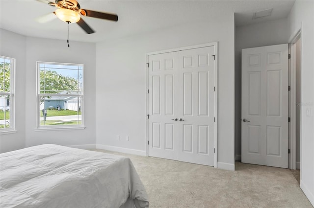 15 Long Pl, Palm Coast, FL 32137 - carpeted bedroom with a closet and ceiling fan