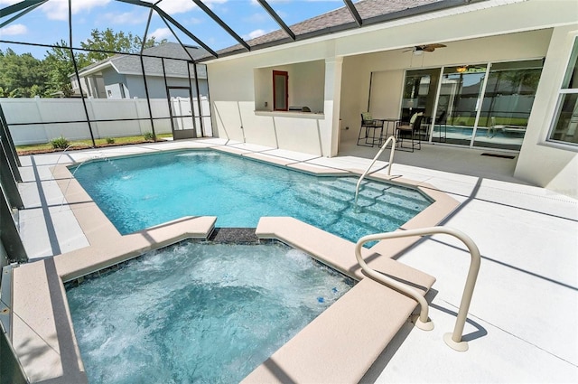 15 Long Pl, Palm Coast, FL 32137 - view of swimming pool with ceiling fan, a patio, and a pool with connected hot tub