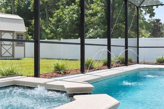 15 Long Pl, Palm Coast, FL 32137 - view of swimming pool with a storage unit, a fenced backyard, and a lanai