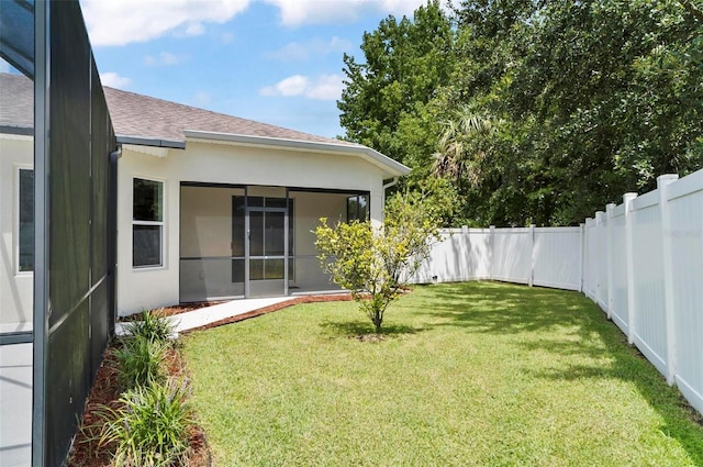 15 Long Pl, Palm Coast, FL 32137 - fenced backyard with a sunroom