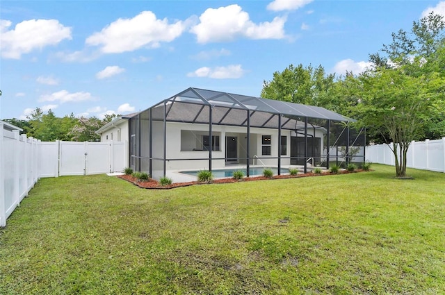 15 Long Pl, Palm Coast, FL 32137 - rear view of property with a fenced backyard, a gate, glass enclosure, and a patio area