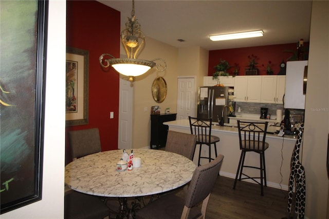 07 Gaston Pl, Palm Coast, FL 32164 - dining space featuring dark wood-style flooring