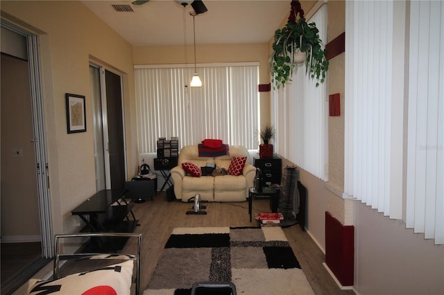 07 Gaston Pl, Palm Coast, FL 32164 - living room with wood finished floors and ceiling fan