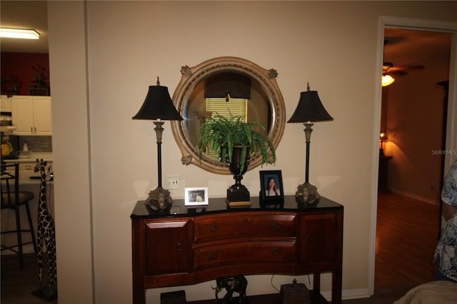 07 Gaston Pl, Palm Coast, FL 32164 - detailed view of ceiling fan, wood finished floors, and decorative backsplash