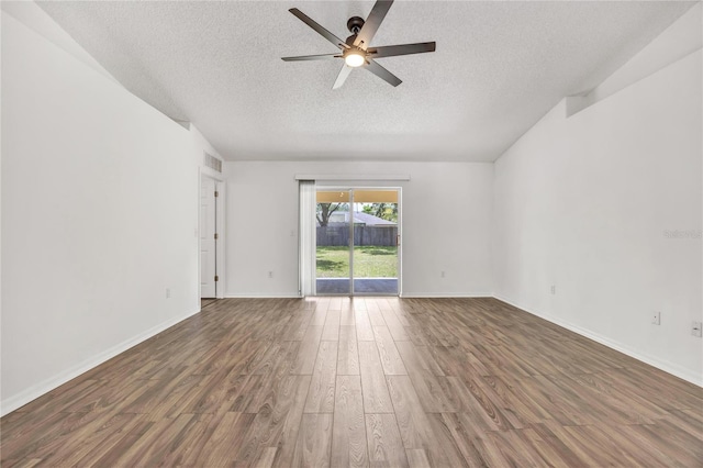 112 Ulaturn Trl, Palm Coast, FL 32164 - unfurnished room featuring a textured ceiling, a ceiling fan, and wood finished floors