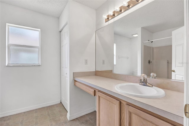 112 Ulaturn Trl, Palm Coast, FL 32164 - bathroom featuring vanity, a shower, and a textured ceiling