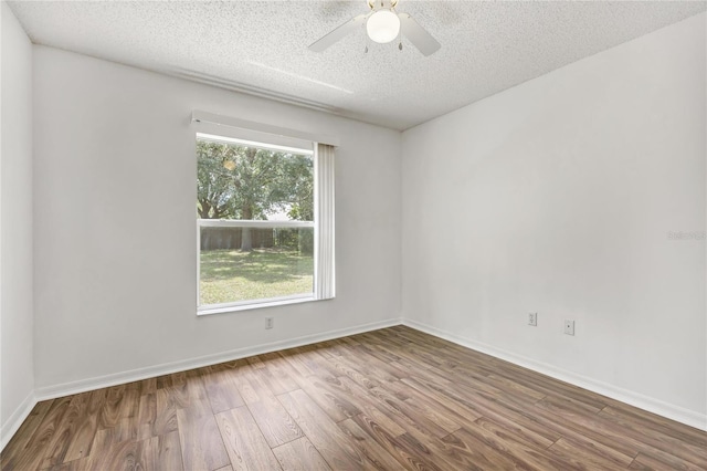 112 Ulaturn Trl, Palm Coast, FL 32164 - spare room with wood finished floors, a textured ceiling, and a ceiling fan