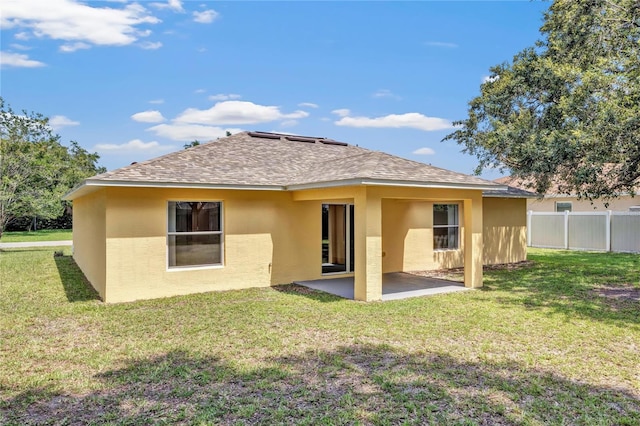 112 Ulaturn Trl, Palm Coast, FL 32164 - rear view of house featuring stucco siding, a patio area, and roof with shingles