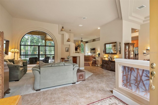 23 Creekside Dr, Palm Coast, FL 32137 - living room featuring tile patterned flooring and a towering ceiling