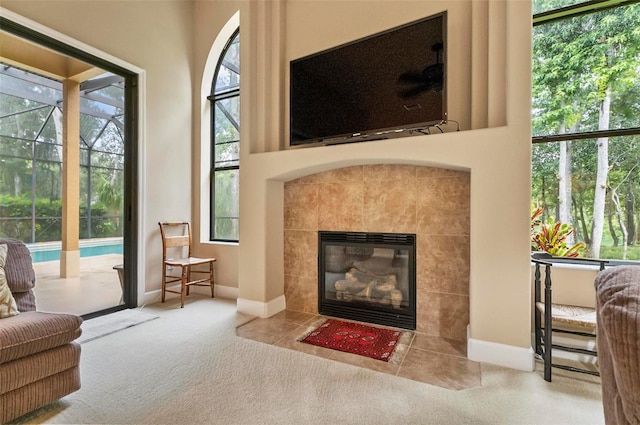 23 Creekside Dr, Palm Coast, FL 32137 - living room featuring carpet, a tile fireplace, and healthy amount of natural light