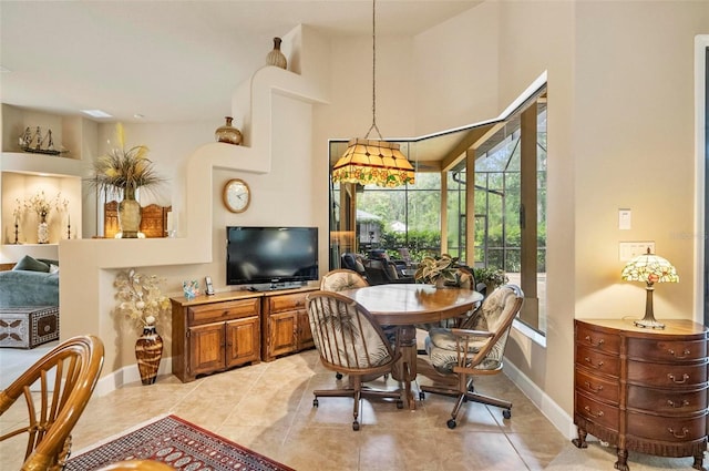 23 Creekside Dr, Palm Coast, FL 32137 - dining space with light tile patterned floors and a high ceiling