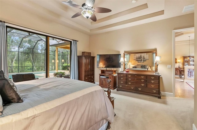 23 Creekside Dr, Palm Coast, FL 32137 - bedroom with a raised ceiling, access to outside, light colored carpet, and ceiling fan