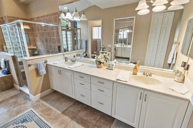 23 Creekside Dr, Palm Coast, FL 32137 - bathroom featuring double vanity, a stall shower, a chandelier, and tile patterned flooring