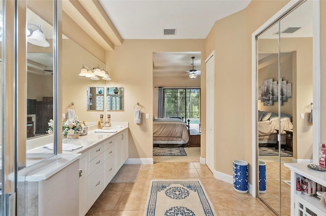 23 Creekside Dr, Palm Coast, FL 32137 - bathroom with ensuite bathroom, double vanity, a ceiling fan, and tile patterned flooring