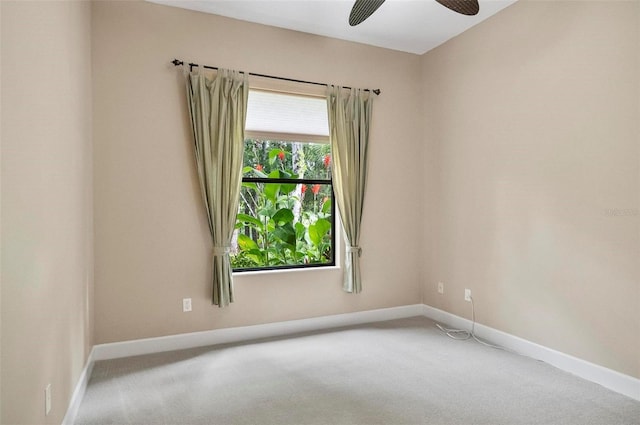 23 Creekside Dr, Palm Coast, FL 32137 - spare room featuring carpet floors and a ceiling fan
