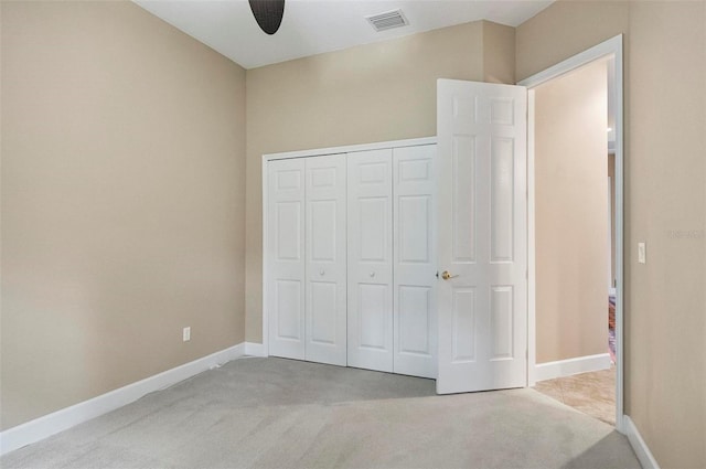23 Creekside Dr, Palm Coast, FL 32137 - unfurnished bedroom with carpet floors, a closet, and a ceiling fan