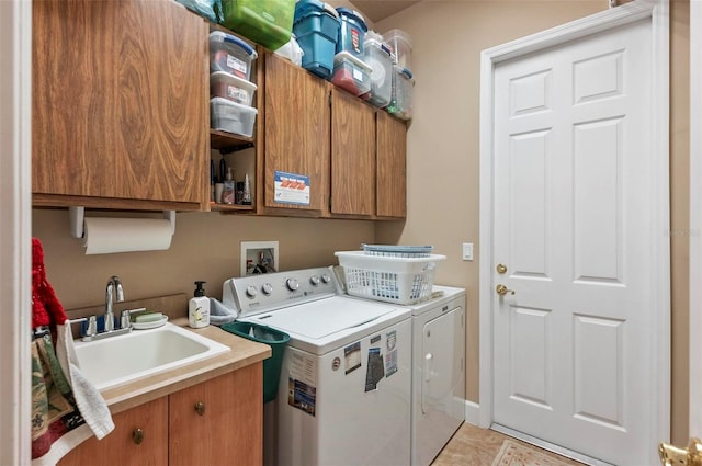23 Creekside Dr, Palm Coast, FL 32137 - laundry area with washer and dryer, cabinet space, and light tile patterned floors