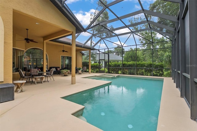 23 Creekside Dr, Palm Coast, FL 32137 - view of swimming pool featuring a ceiling fan, a patio, a pool with connected hot tub, glass enclosure, and an outdoor living space