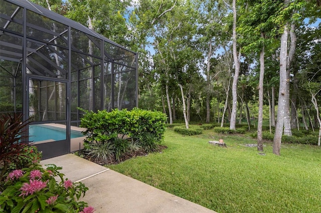 23 Creekside Dr, Palm Coast, FL 32137 - view of grassy yard with an outdoor pool and glass enclosure