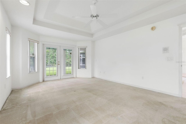 16 Birchwood Pl, Palm Coast, FL 32137 - spare room with carpet, french doors, a tray ceiling, ceiling fan, and recessed lighting