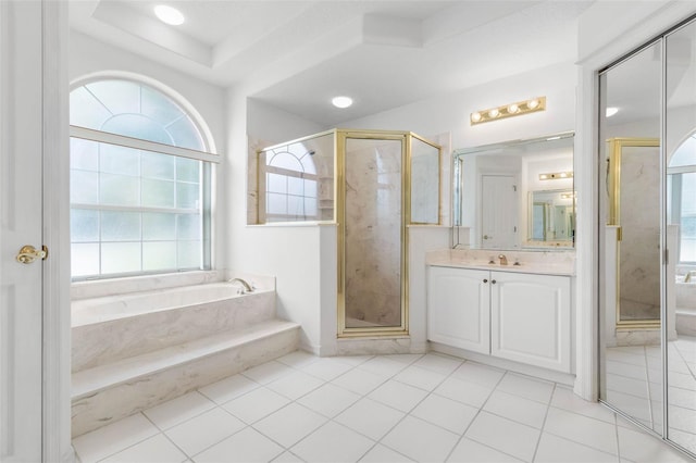 16 Birchwood Pl, Palm Coast, FL 32137 - bathroom with vanity, a garden tub, a stall shower, and tile patterned floors