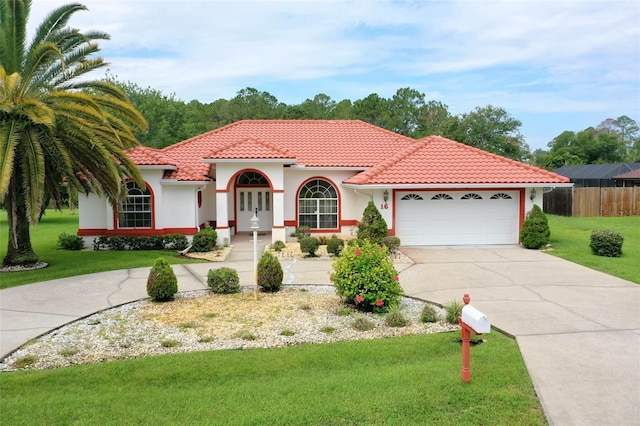 16 Birchwood Pl, Palm Coast, FL 32137 - mediterranean / spanish home with concrete driveway, a garage, a tiled roof, and stucco siding