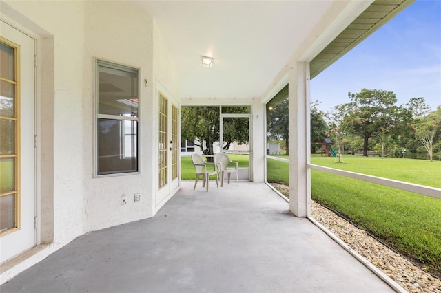 16 Birchwood Pl, Palm Coast, FL 32137 - view of patio featuring a playground