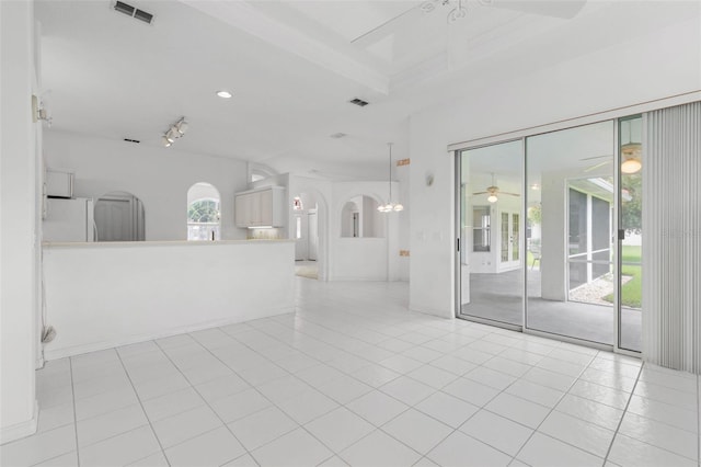 16 Birchwood Pl, Palm Coast, FL 32137 - unfurnished living room featuring arched walkways, ceiling fan, light tile patterned floors, beamed ceiling, and recessed lighting