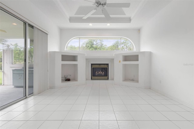 16 Birchwood Pl, Palm Coast, FL 32137 - unfurnished living room with a glass covered fireplace, ceiling fan, recessed lighting, built in features, and a tray ceiling