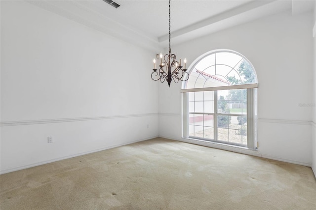 16 Birchwood Pl, Palm Coast, FL 32137 - carpeted spare room featuring a chandelier