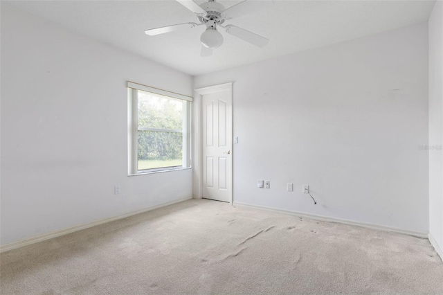 16 Birchwood Pl, Palm Coast, FL 32137 - carpeted empty room with baseboards and a ceiling fan