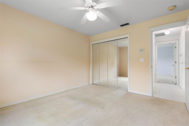 16 Birchwood Pl, Palm Coast, FL 32137 - unfurnished bedroom featuring carpet floors, a closet, and a ceiling fan