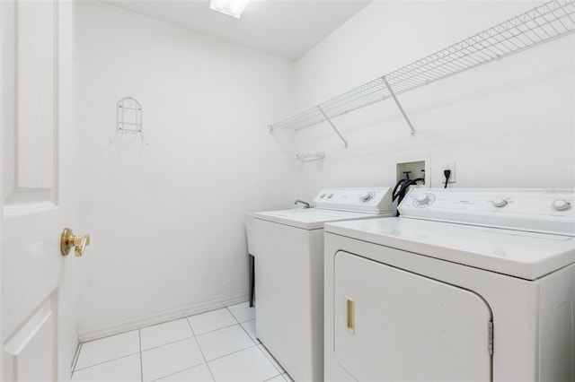 16 Birchwood Pl, Palm Coast, FL 32137 - laundry room with separate washer and dryer and light tile patterned floors