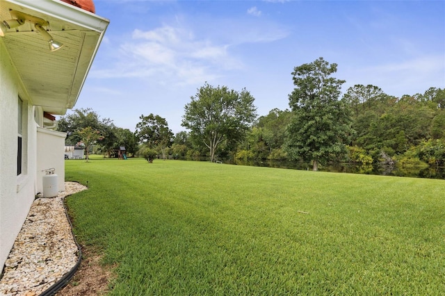 16 Birchwood Pl, Palm Coast, FL 32137 - view of grassy yard with a playground