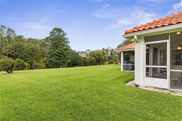 16 Birchwood Pl, Palm Coast, FL 32137 - view of green lawn featuring a sunroom