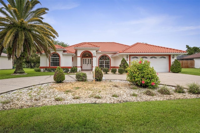 16 Birchwood Pl, Palm Coast, FL 32137 - mediterranean / spanish-style home with concrete driveway, an attached garage, stucco siding, and a tile roof
