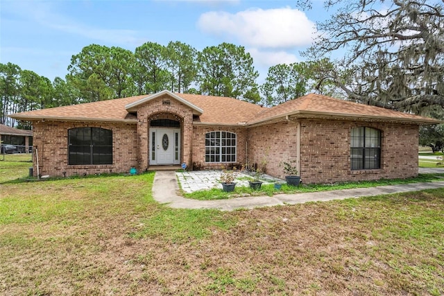 2790 Pelham Cir, Deltona, FL 32738 - single story home with a front lawn, brick siding, and roof with shingles