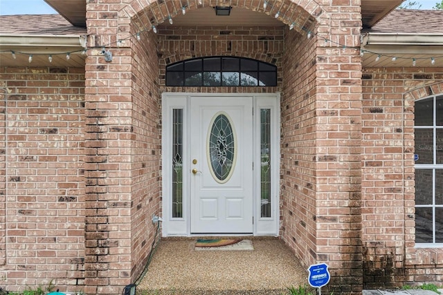 2790 Pelham Cir, Deltona, FL 32738 - doorway to property featuring brick siding and a shingled roof